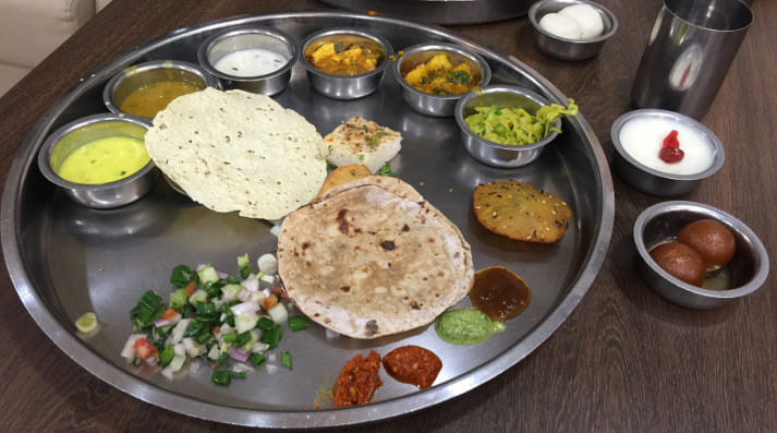 It is about Dhoklas, Theplas, Undhiyu, Khadvi, Srikhand, Gujarati Dal, Khadi and Bhakris, it is about enjoying Gujarati food!