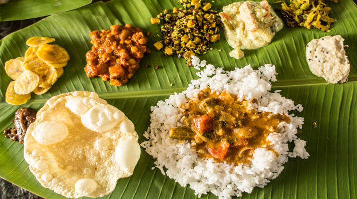 The traditional ela sadya with all the traditional sadya dishes is an experience to be had.