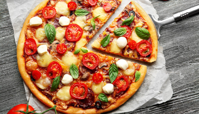 Let your weekend binging plans commence with these drool-worthy pizza serving restaurants in Delhi