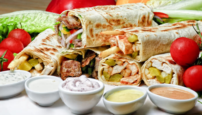 Taste the magic of Middle-East by gorging on these delicious and juicy Shawarmas 