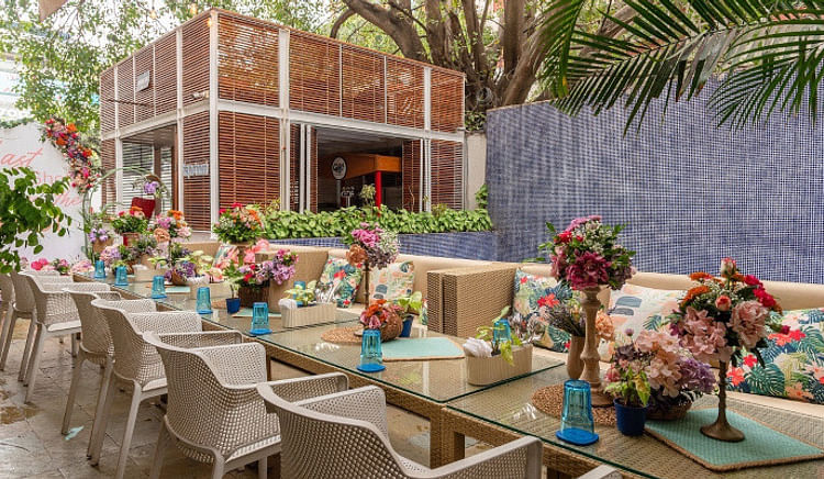 Scrumptious bites and eclectic drinks await at this poolside dining marvel