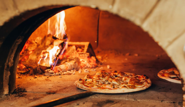 Where smoky crusts meet cheesy perfection