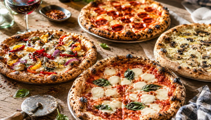 Think molten cheese, fluffy crusts, and gourmet toppings at these standout restaurants across the Pink City