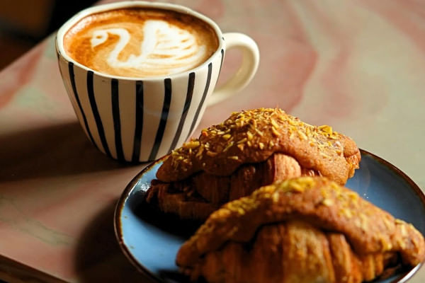 pistachio croissant and cappuccino, Lila-Curated Experiences, Kochi