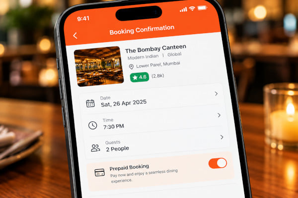A diner confirming a prepaid restaurant booking on a mobile app with date and guest count selected